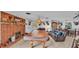 Game room includes a pool table, brick fireplace, and plenty of space for entertainment at 4264 Stafford Dr, Winter Haven, FL 33880