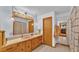Bathroom with a pink sink and wooden vanity at 4264 Stafford Dr, Winter Haven, FL 33880
