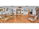 Bright dining room features hardwood floors, a wood dining table and chairs, and a large hutch at 4264 Stafford Dr, Winter Haven, FL 33880
