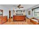 Bright bedroom featuring a large bed and wood floors at 4264 Stafford Dr, Winter Haven, FL 33880