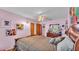 Quaint bedroom with cow artwork and wood floors at 4264 Stafford Dr, Winter Haven, FL 33880