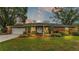 Brick house with a well-maintained lawn and landscaping at 4264 Stafford Dr, Winter Haven, FL 33880