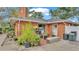 Brick patio with potted plants, storage, and access to home at 4264 Stafford Dr, Winter Haven, FL 33880
