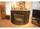 Living room fireplace with granite surround and decorative mantel at 108 Lake Region N Blvd, Winter Haven, FL 33881
