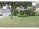 Beautiful house exterior with lush landscaping and a welcoming front entrance at 108 Lake Region N Blvd, Winter Haven, FL 33881