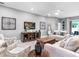 Relaxing living room with neutral color palette and comfortable seating at 1324 Melrose St, Lake Alfred, FL 33850