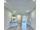 Open living room with tile flooring and high ceilings at 1564 Leamington Ln, Winter Haven, FL 33884