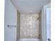 Small bathroom with tub and tile surround at 1564 Leamington Ln, Winter Haven, FL 33884