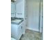 Clean bathroom with vanity, sink, and tiled flooring at 1564 Leamington Ln, Winter Haven, FL 33884