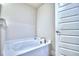 Modern bathroom featuring a soaking tub at 1564 Leamington Ln, Winter Haven, FL 33884
