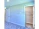 Spacious bedroom with carpet, double closets, and an adjoining bathroom at 1564 Leamington Ln, Winter Haven, FL 33884