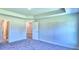 Spacious bedroom with plush carpeting and an ensuite bathroom at 1564 Leamington Ln, Winter Haven, FL 33884