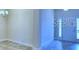 Bright and airy entryway with tile flooring and modern light fixture at 1564 Leamington Ln, Winter Haven, FL 33884