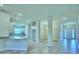 Open kitchen with white cabinets and an island at 1564 Leamington Ln, Winter Haven, FL 33884