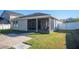 Screened patio and brick paved walkway in backyard at 1849 Charleston Ln, Bartow, FL 33830