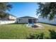 Large backyard with fire pit and plenty of green space at 1849 Charleston Ln, Bartow, FL 33830