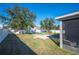 Spacious backyard with fire pit and screened patio at 1849 Charleston Ln, Bartow, FL 33830