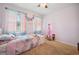 Light and airy bedroom with a twin bed and colorful decor at 1849 Charleston Ln, Bartow, FL 33830