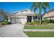 One-story home with a two-car garage and landscaped front yard at 1849 Charleston Ln, Bartow, FL 33830