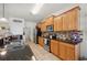 Modern kitchen with wood cabinets, granite counters, and stainless steel appliances at 1849 Charleston Ln, Bartow, FL 33830