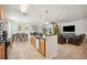 Open kitchen with island, looking toward living room at 1849 Charleston Ln, Bartow, FL 33830