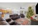 Open living room with view of kitchen and Christmas tree at 1849 Charleston Ln, Bartow, FL 33830