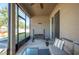 Covered porch with seating and a woodpile, offering extra space at 1849 Charleston Ln, Bartow, FL 33830