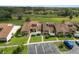 Aerial view of townhouses, ample parking, and surrounding landscape at 5225 Imperial Lakes Blvd # 22, Mulberry, FL 33860