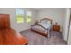 Bright bedroom with a double bed and wood furniture at 6577 Great Bear Dr, Lakeland, FL 33805