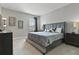 Large Primary bedroom with a king-size bed and ensuite at 7004 Oakwood St, Davenport, FL 33837