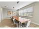 Bright dining room featuring a long wooden table at 7004 Oakwood St, Davenport, FL 33837
