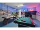 Fun game room with pool table, air hockey, and arcade games at 7004 Oakwood St, Davenport, FL 33837