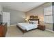 Bedroom with king-size bed and ensuite at 7004 Oakwood St, Davenport, FL 33837