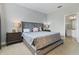 Spacious Primary bedroom with large bed and ensuite bathroom at 7004 Oakwood St, Davenport, FL 33837