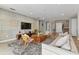 Open concept living area with modern decor, comfortable seating and a view of the backyard at 7004 Oakwood St, Davenport, FL 33837