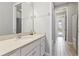 Clean bathroom with single sink vanity, shower/tub combo, and tile flooring at 7004 Oakwood St, Davenport, FL 33837
