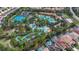 Aerial view of community with pools, water features, and tennis courts at 7004 Oakwood St, Davenport, FL 33837