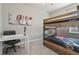 Bedroom with bunk beds, desk, and guitar-themed wall art at 7004 Oakwood St, Davenport, FL 33837
