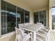 Outdoor patio with large table perfect for dining al fresco at 7004 Oakwood St, Davenport, FL 33837