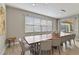 Spacious dining room with a large wooden table and access to the pool at 7004 Oakwood St, Davenport, FL 33837
