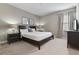 Bedroom with king-size bed and ensuite at 7004 Oakwood St, Davenport, FL 33837