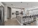 Modern kitchen with stainless steel appliances and an island at 7004 Oakwood St, Davenport, FL 33837
