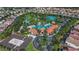 Aerial view of community pool, water features, tennis courts and homes at 7004 Oakwood St, Davenport, FL 33837