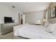 Comfortable bedroom with a queen-size bed and en-suite bathroom at 7004 Oakwood St, Davenport, FL 33837