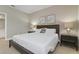 Bedroom with king-size bed and ensuite at 7004 Oakwood St, Davenport, FL 33837