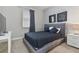 Cozy bedroom with a plush bed and modern decor at 7004 Oakwood St, Davenport, FL 33837