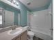 Clean bathroom, featuring a bathtub, shower, and updated vanity at 742 Sonja Cir, Davenport, FL 33897