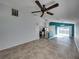 Open concept living room and kitchen with tile floor and view of the pool at 742 Sonja Cir, Davenport, FL 33897