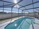 Expansive screened-in pool area with backyard view at 742 Sonja Cir, Davenport, FL 33897