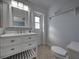 Bathroom features updated vanity, toilet, and a walk-in shower at 742 Sonja Cir, Davenport, FL 33897